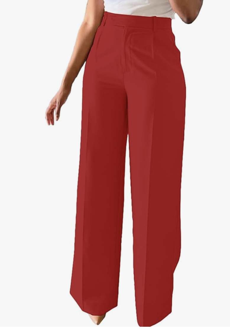 Fashion editor wearing high-waisted red wide-leg dress pants with a front-crease detail, demonstrating a sophisticated 2026 monochrome outfit formula.