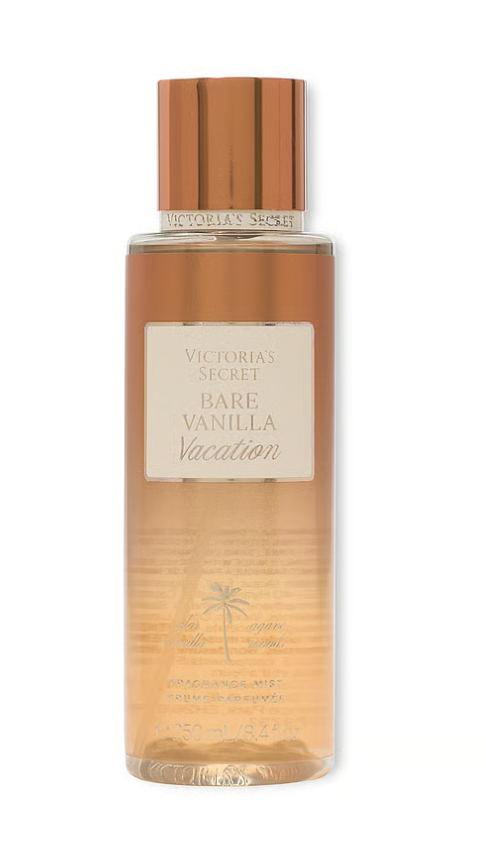 A bottle of Victoria’s Secret Bare Vanilla fragrance mist featuring a gold cap and amber-colored liquid on a transparent background.