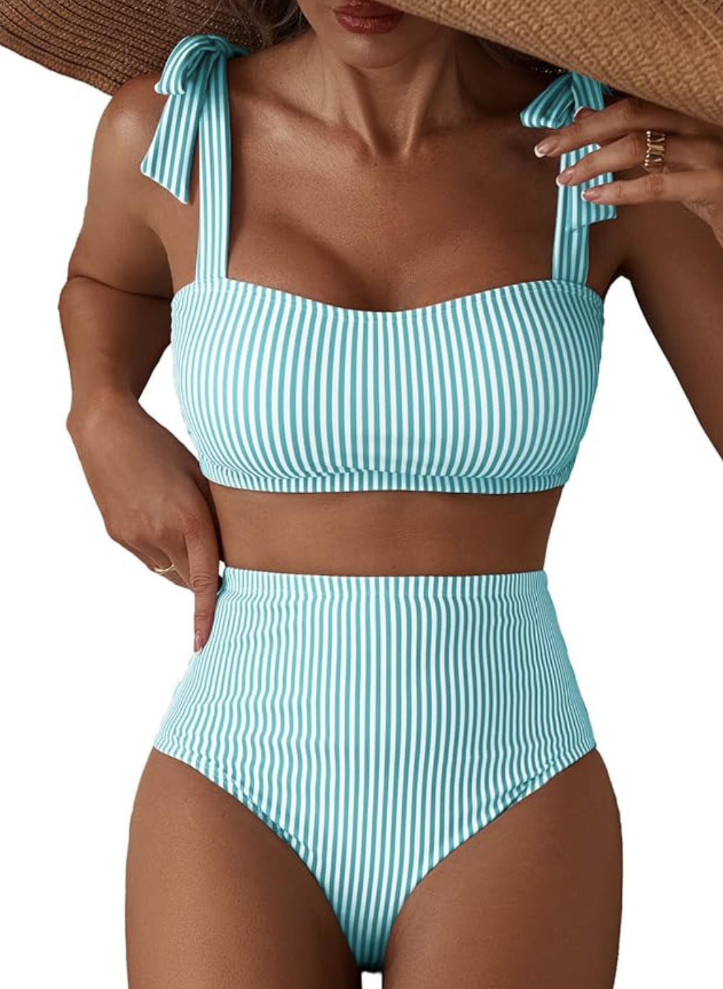 A close-up of a person wearing a two-piece bikini set featuring a teal and white vertically striped pattern, high-waisted bottoms, and a matching top with thick shoulder straps.