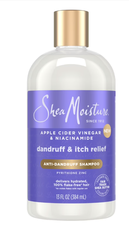 A bottle of SheaMoisture Anti-Dandruff Shampoo with Apple Cider Vinegar and Salicylic Acid for scalp pH balance.
