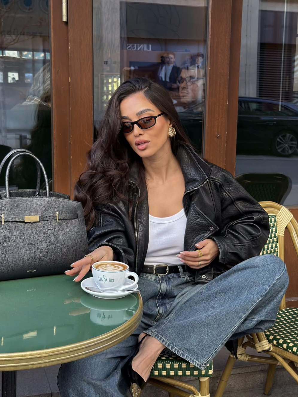 Samira Safi styling a cropped leather bomber jacket with high-waisted wide-leg jeans to balance a long torso and create the illusion of longer legs