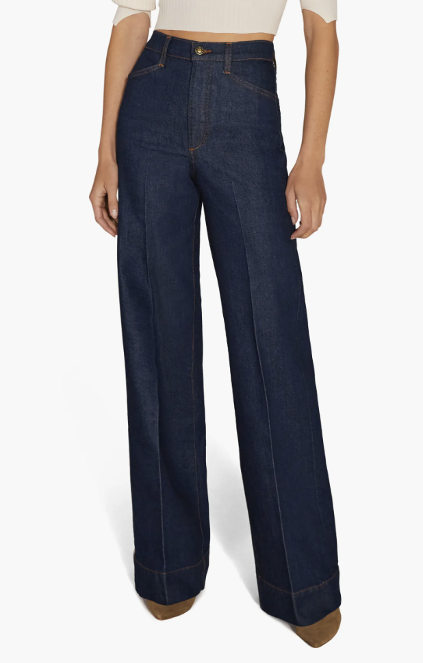 Favorite Daughter The Mischa dark wash super high-waist wide-leg jeans with center front seams paired with pointed-toe boots