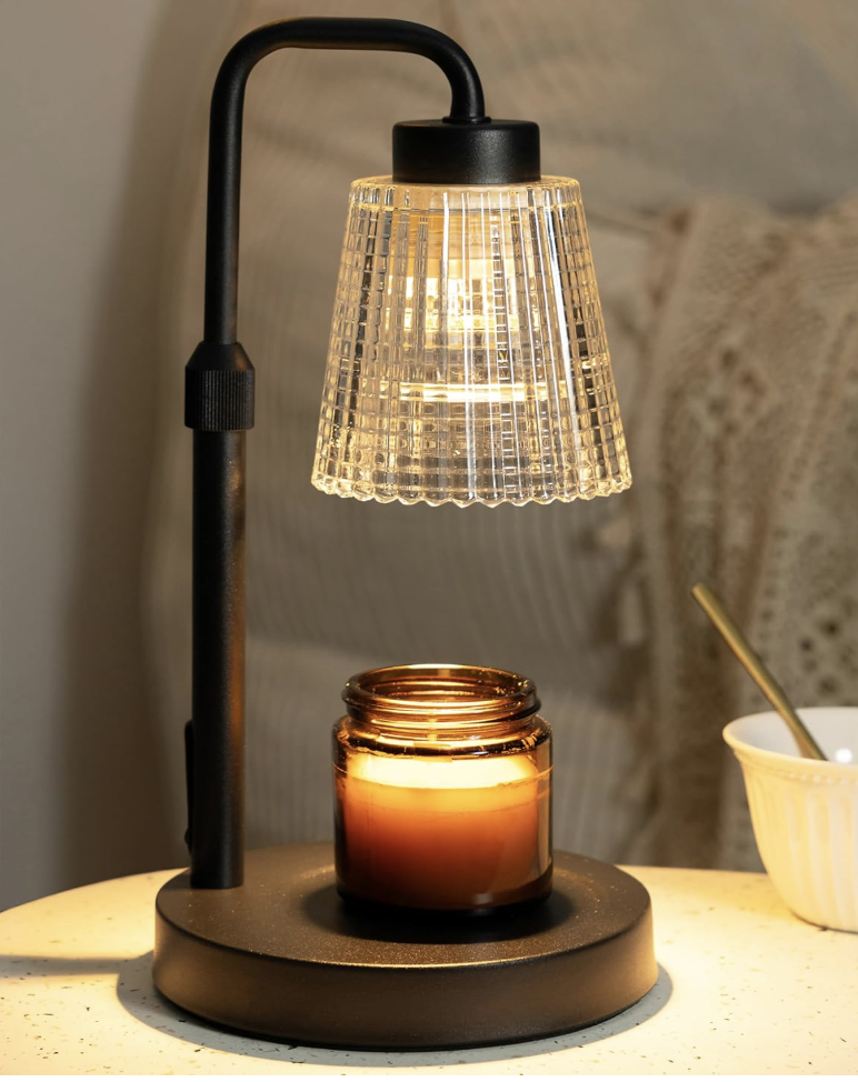 GODONLIF electric candle warmer lamp featuring a black curved neck and clear fluted glass shade warming an amber glass candle jar.