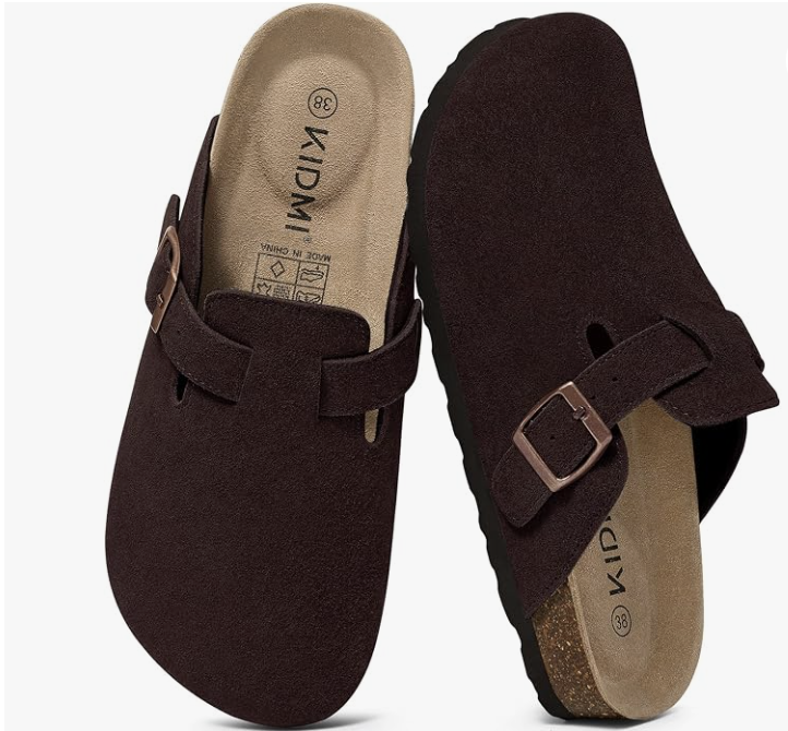 Dark brown suede buckle-strap clogs with cork footbeds.