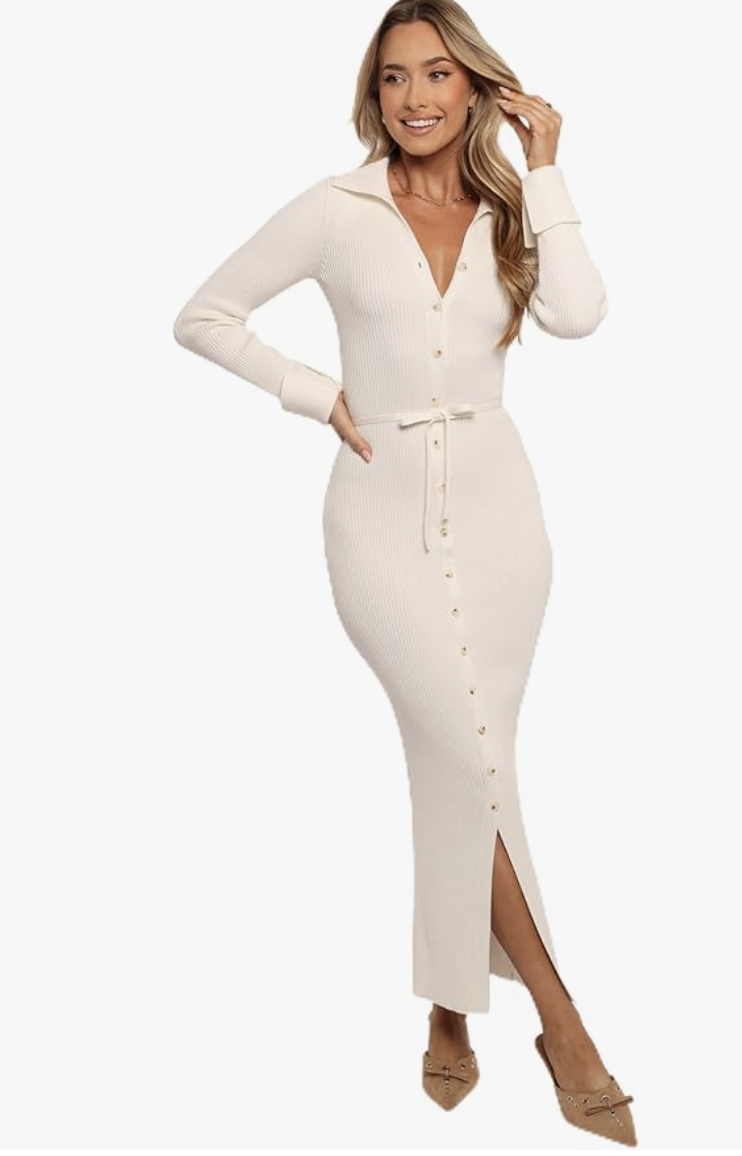 A woman wearing the white Petal & Pup Kadi Maxi Dress, featuring a button-up front, collar, and long sleeves with a waist tie.
