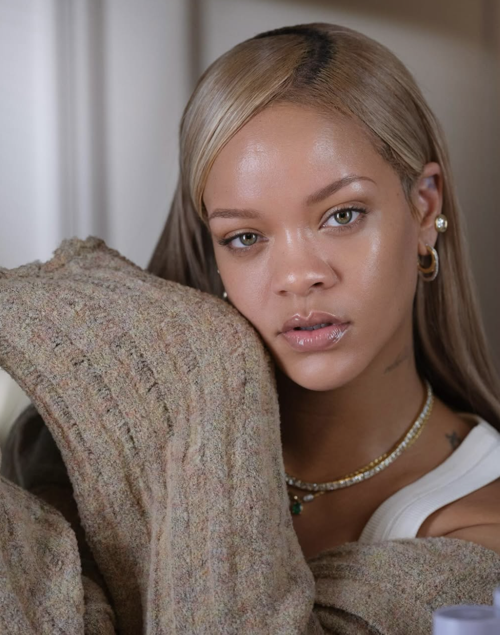 Rihanna wearing a muted brown textured knit top, showcasing the clear and vivid features characteristic of High Chroma in color analysis.