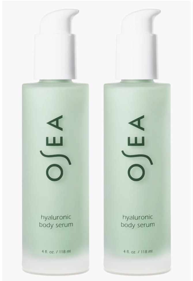 A close-up of two light green frosted glass bottles of OSEA Hyaluronic Body Serum with white pump tops, a Nordstrom exclusive set.