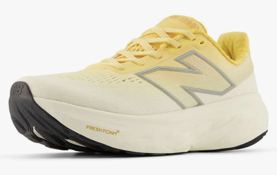 A side profile of the New Balance Fresh Foam X 1080 v14 in a pale yellow colorway, featuring a thick Fresh Foam midsole for shock absorption and concrete walking.