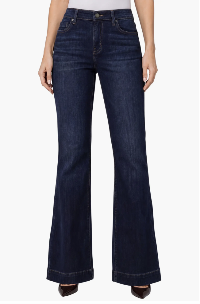 Woman wearing Liverpool Los Angeles pintuck bootcut jeans with vertical front seams and a flared hem