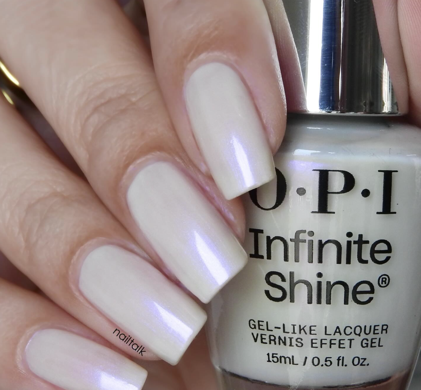 A close-up of a pearlescent milky white manicure using OPI Kyoto Oyster from the New OPIcons Spring 2026 collection.