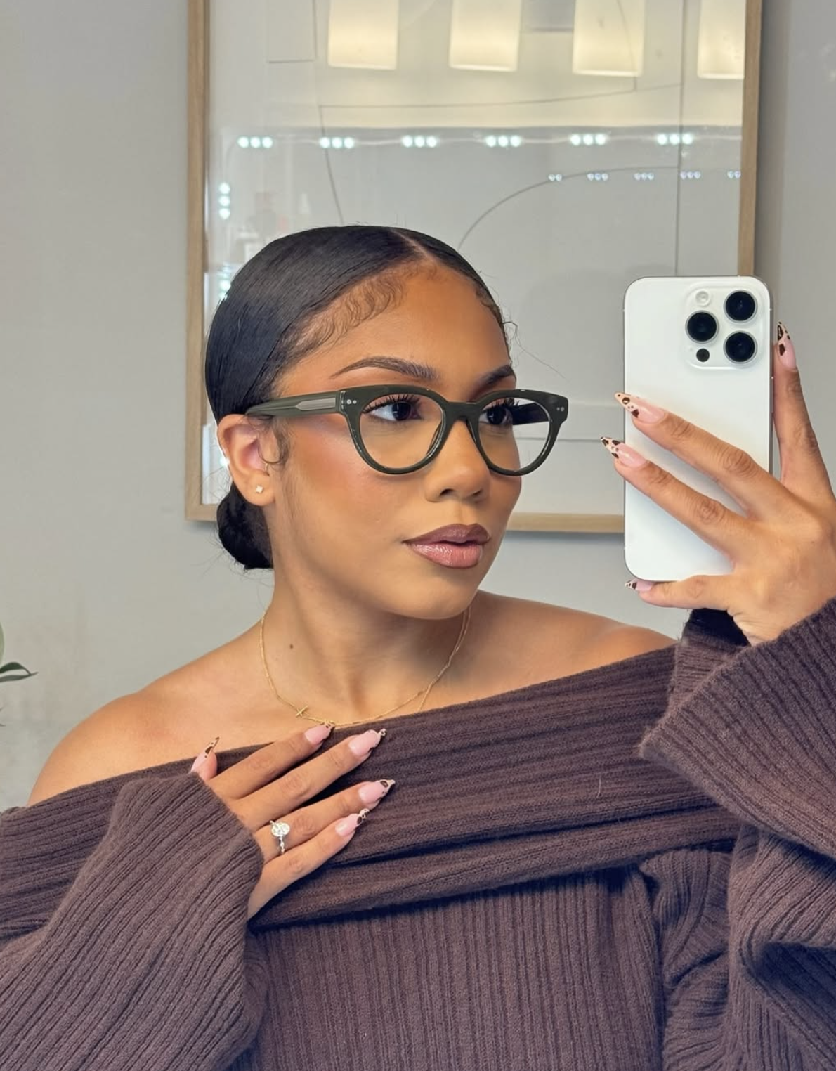 Woman with a square face shape wearing eyeglasses, styling inspiration for square face frames.