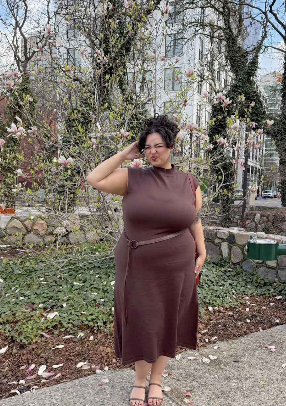 Plus-size woman in a brown midi dress.