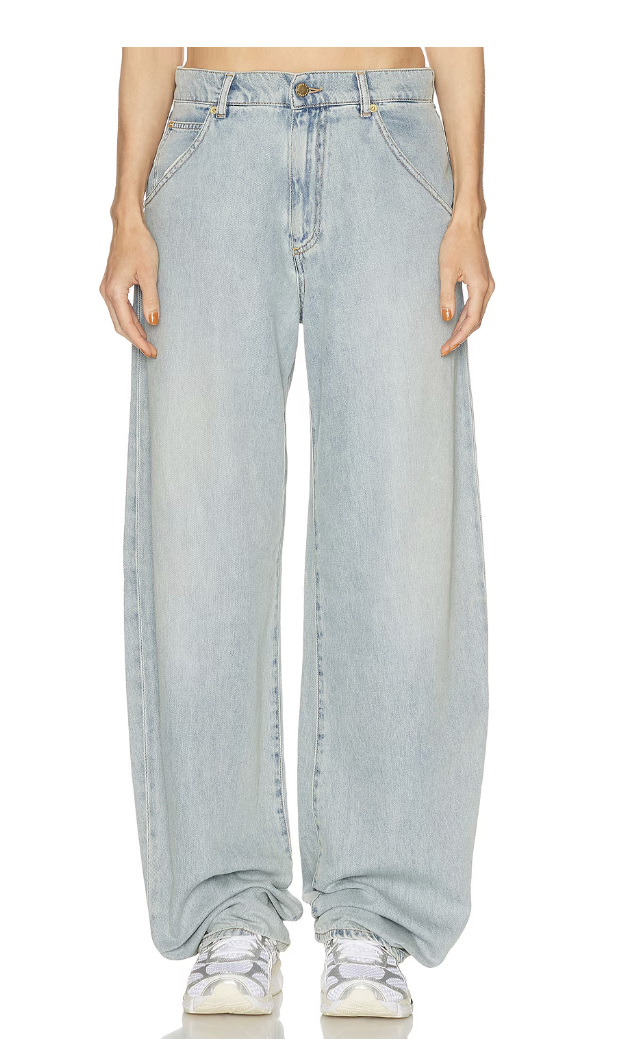 A person wearing light-wash, high-waisted Levi's wide-leg jeans with front utility-style pockets.