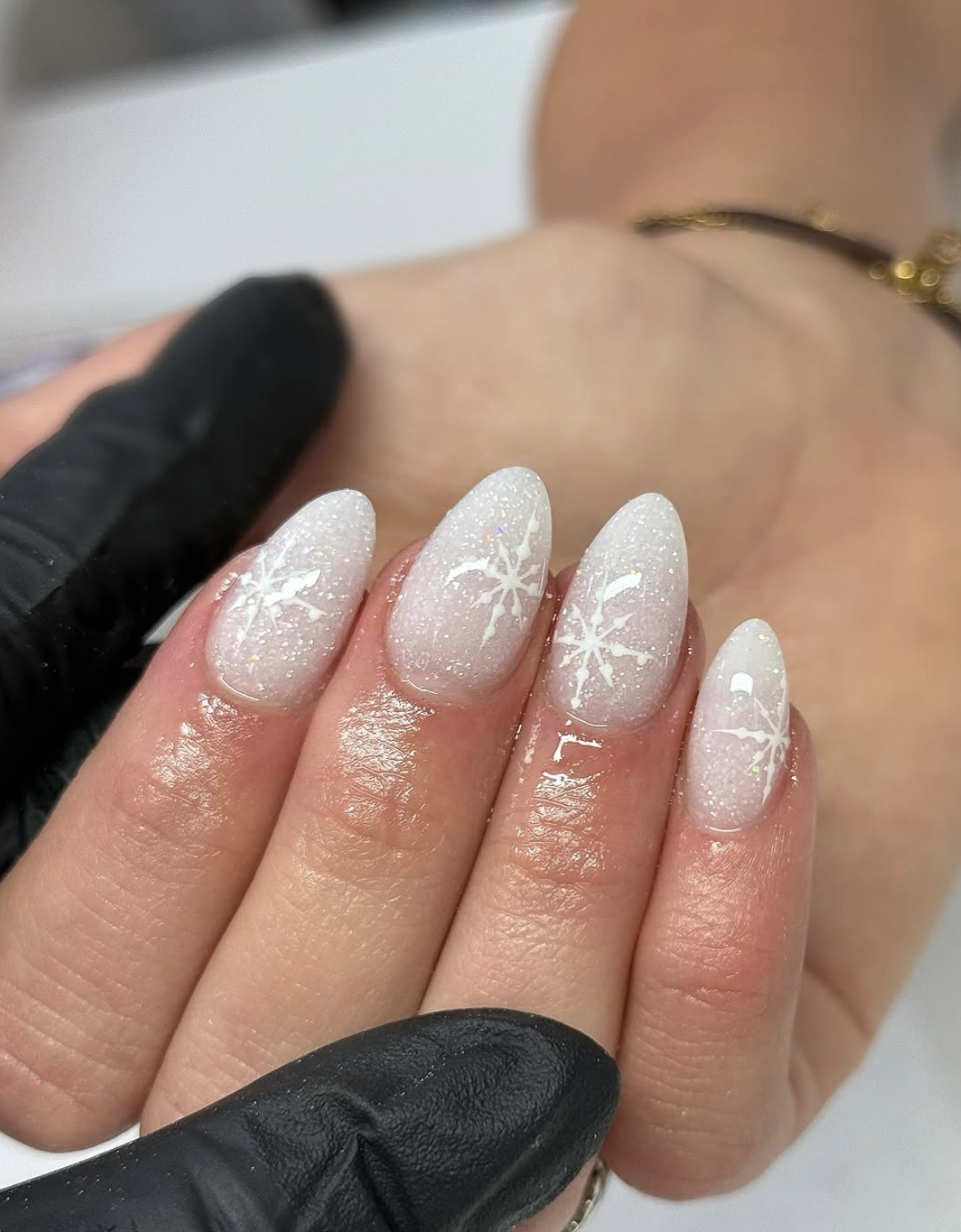 Milky white Christmas nails with delicate snowflake accents