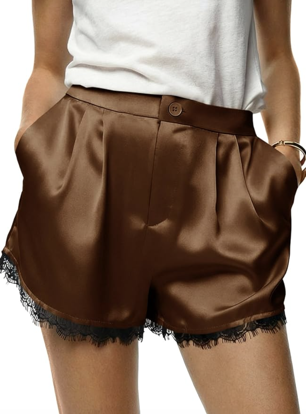 : A pair of brown satin high-waisted shorts with black lace trim and button detailing, styled for a chic summer evening look.