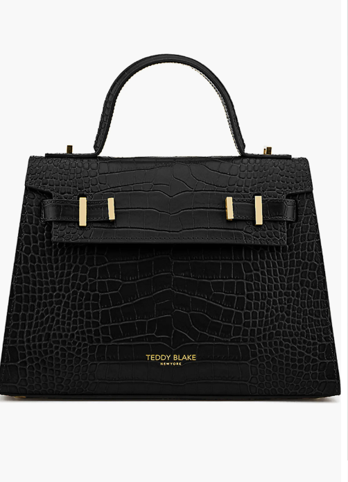"Teddy Blake Ava Croco 11" in black embossed croc leather, featuring a structured top-handle silhouette and gold hardware."
