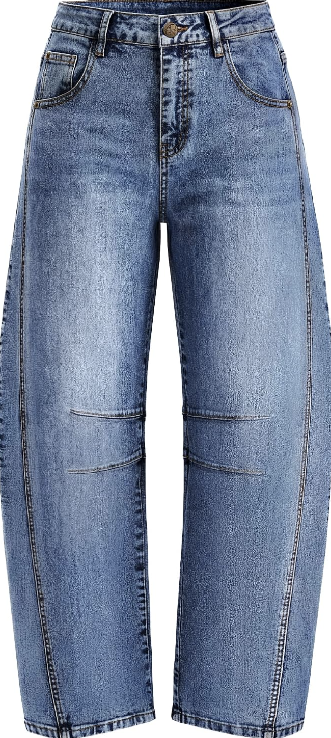 A close-up of dark-wash denim barrel jeans featuring distinct architectural curved leg seams and tailored pleat detailing at the knee.