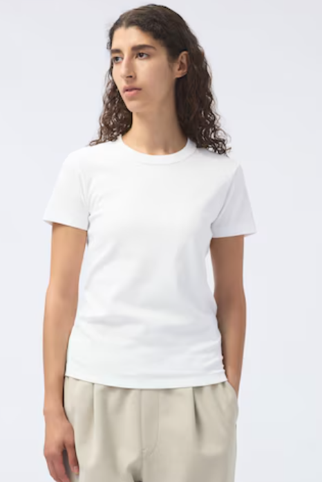 Woman wearing the Uniqlo Crew Neck, a thick white t-shirt that isn't see-through.