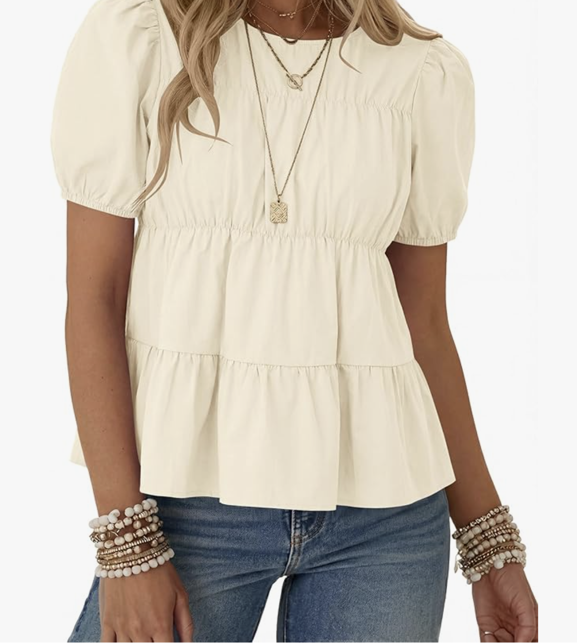 A woman wearing the Rapbin apricot-toned puff sleeve babydoll top with a tiered bodice and square neckline, styled as a feminine Amazon spring fashion staple.
