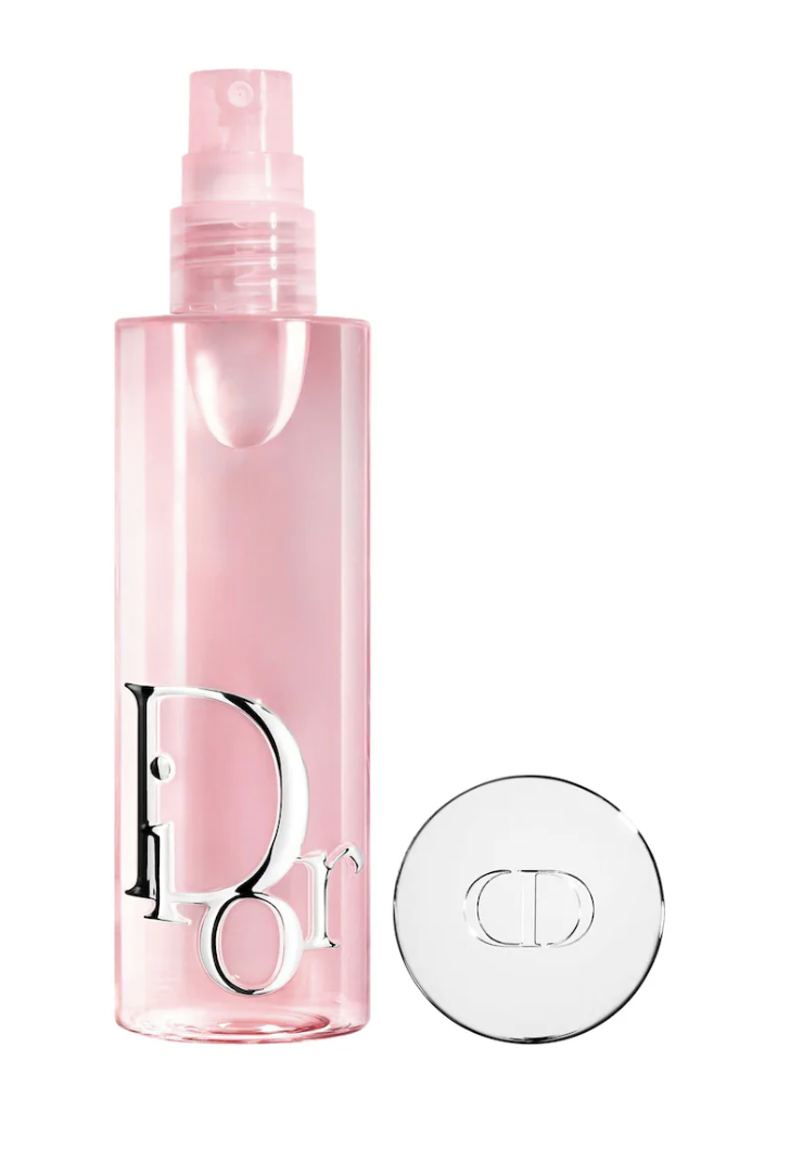 A close-up view of a chic pink Dior Forever Glow Maximizer liquid highlighter bottle alongside a smooth, radiant liquid swatch on a clean background.
