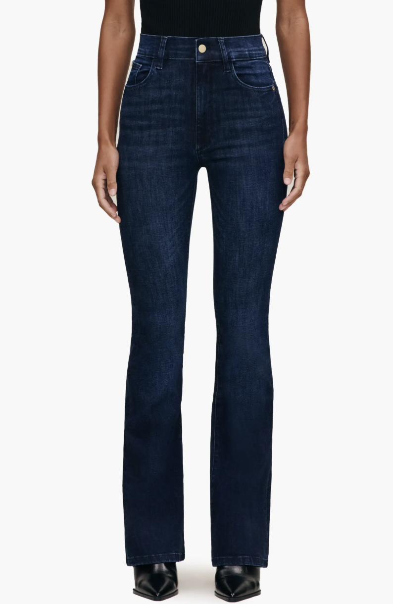 Model wearing DL1961 Bridget Boot Instasculpt High Rise Jeans in a dark indigo wash, designed with high-recovery denim to fit muscular thighs and a rectangle body shape.