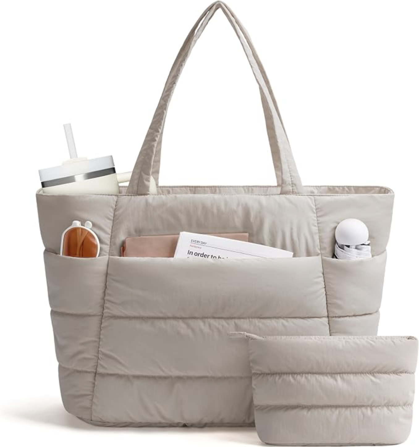 Quilted Narwey travel tote with exterior pockets and a zip-top opening.
