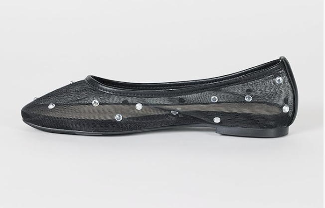 Black dotted mesh ballet flats with an ankle strap, a breathable and trending spring 2026 footwear essential.