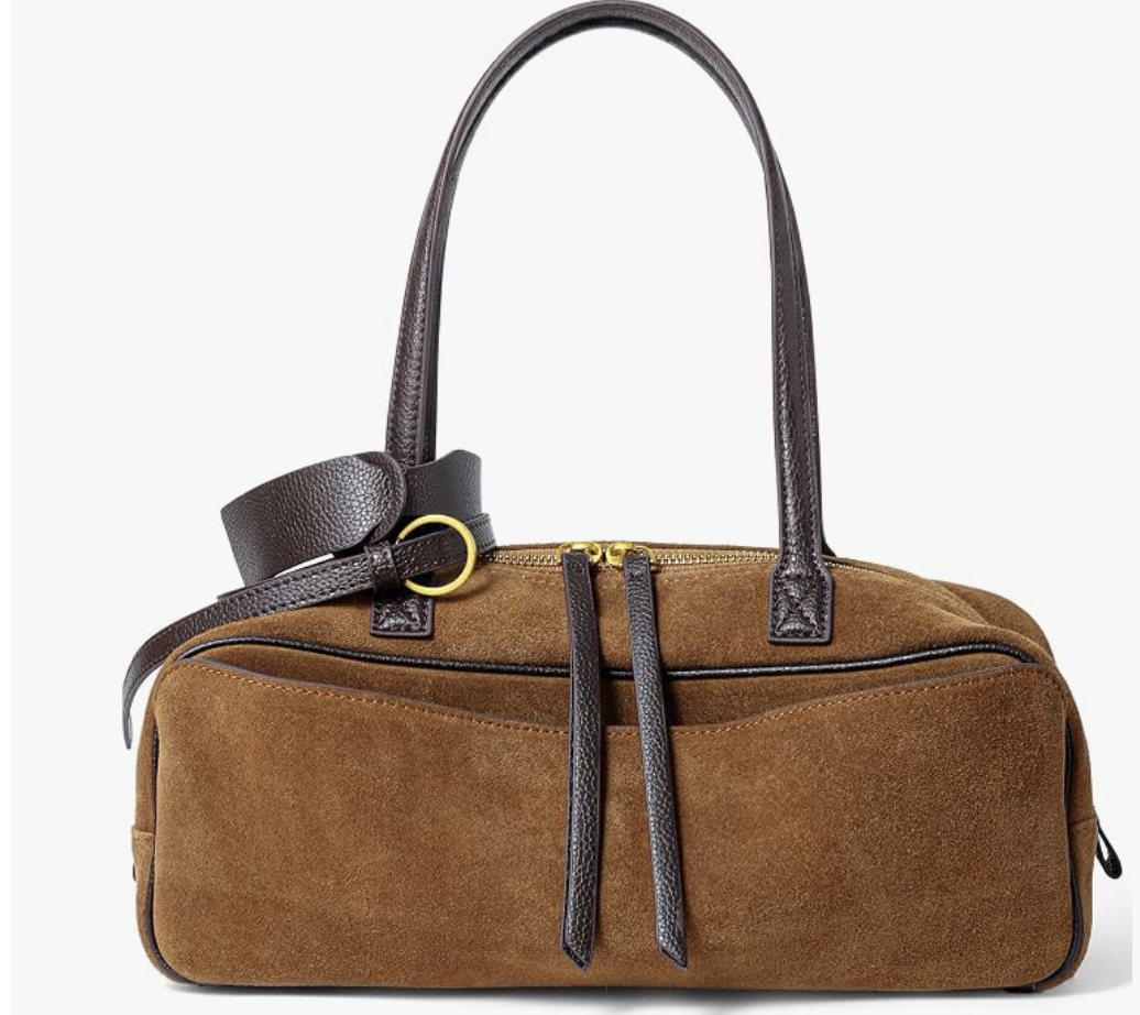 An east-west brown suede shoulder bag featuring dark brown leather straps, gold buckle detail, and dual front zipper pulls.