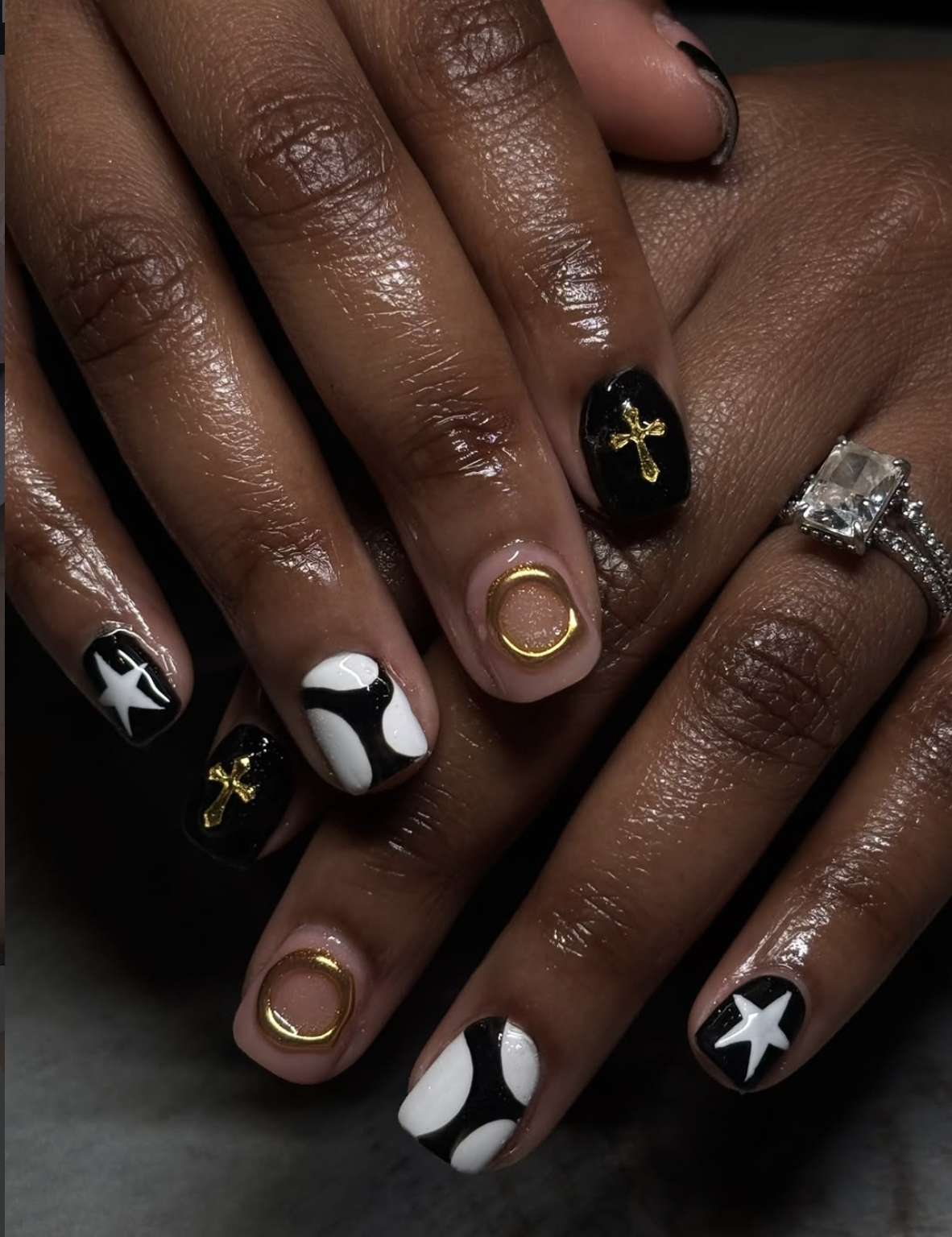 Short black winter nails with minimal gold nail art