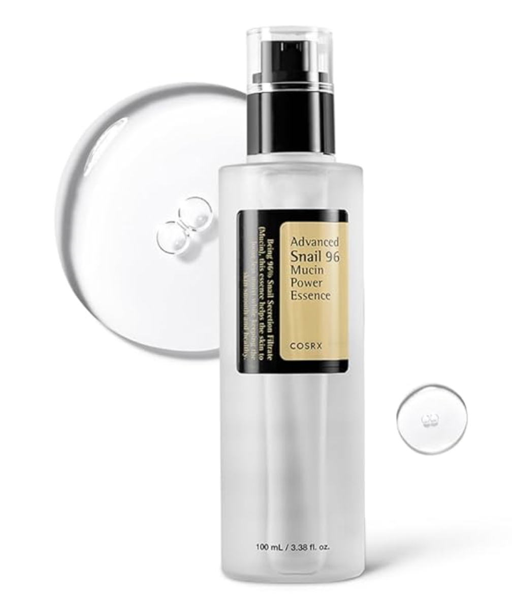 A bottle of COSRX Advanced Snail 96 Mucin Power Essence next to a clear droplet of the serum.