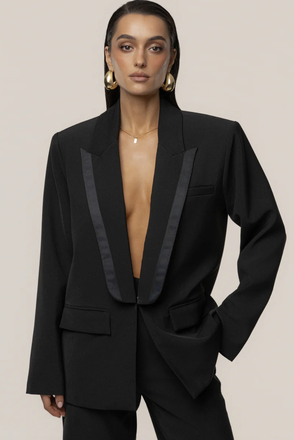 Close-up of the JLuxLabel Black Suite Life Woven Blazer, a structured oversized black blazer with satin lapels, styled as part of a polished fashion editor-inspired outfit.