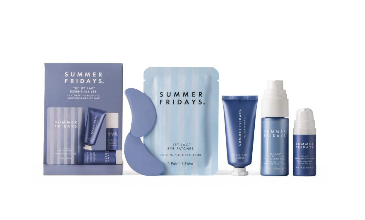 Summer Fridays Jet Lag Essentials Set featuring travel-sized skincare products, including the Jet Lag Mask, eye patches, and hydrating mist set against a light blue background.