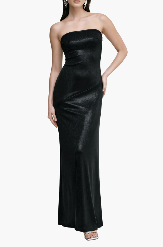 Woman wearing a Marcella Ciel strapless metallic gown paired with silver open-toe heels