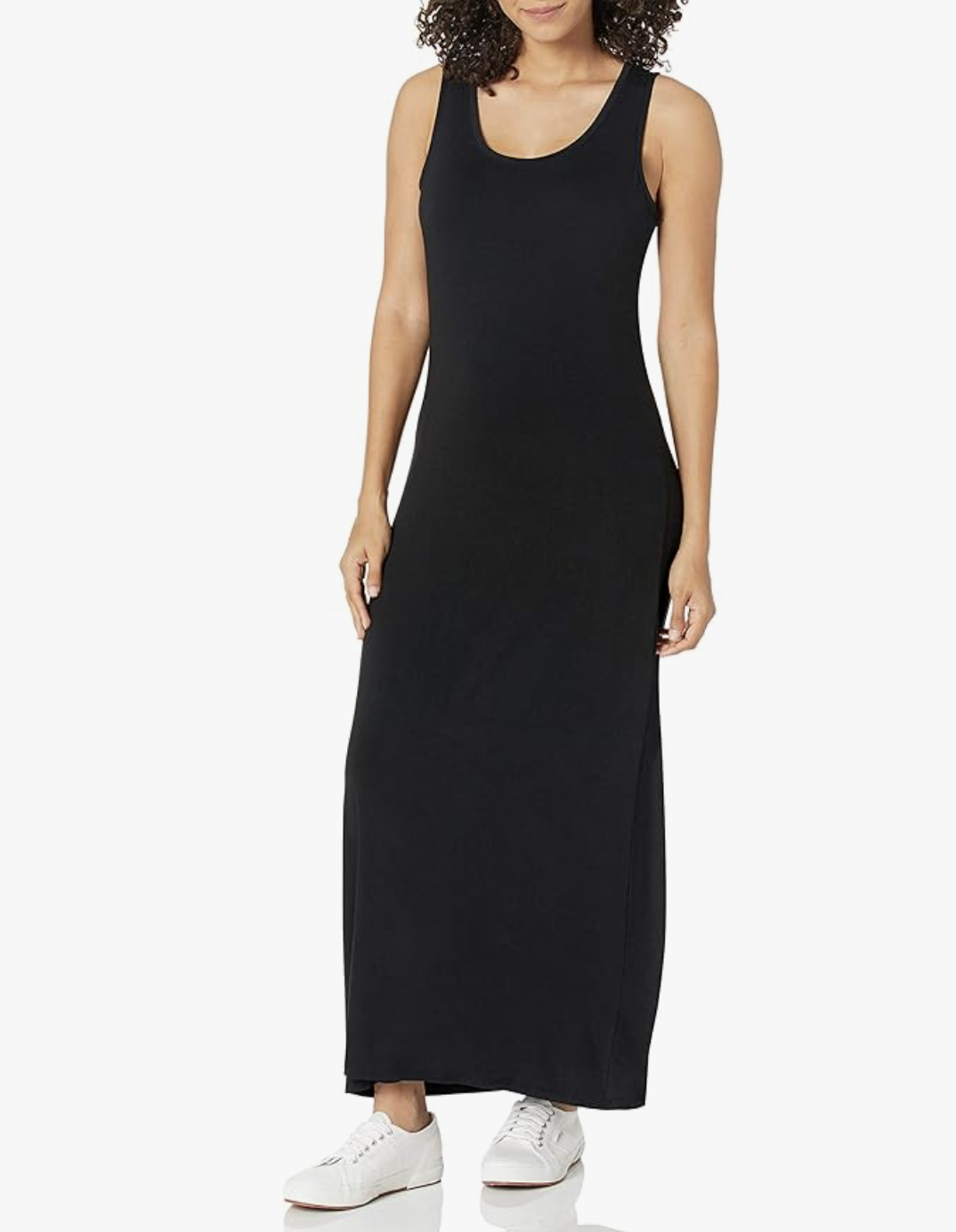 A person wearing a long black tank maxi dress paired with white low-top sneakers, demonstrating a casual and comfortable summer BBQ outfit.