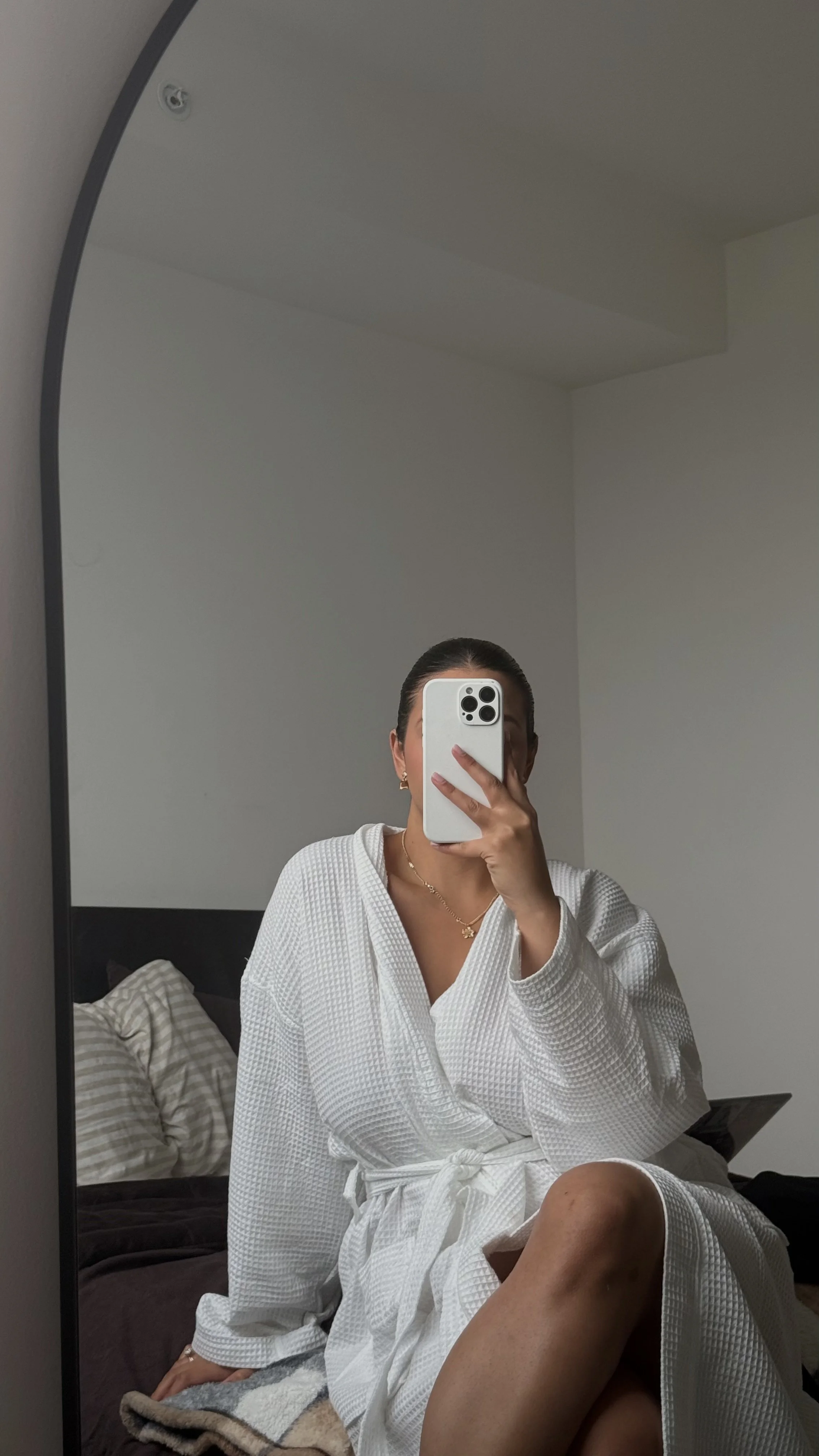 Affordable little luxuries including flowers, a ceramic mug, hand cream and a soft robe