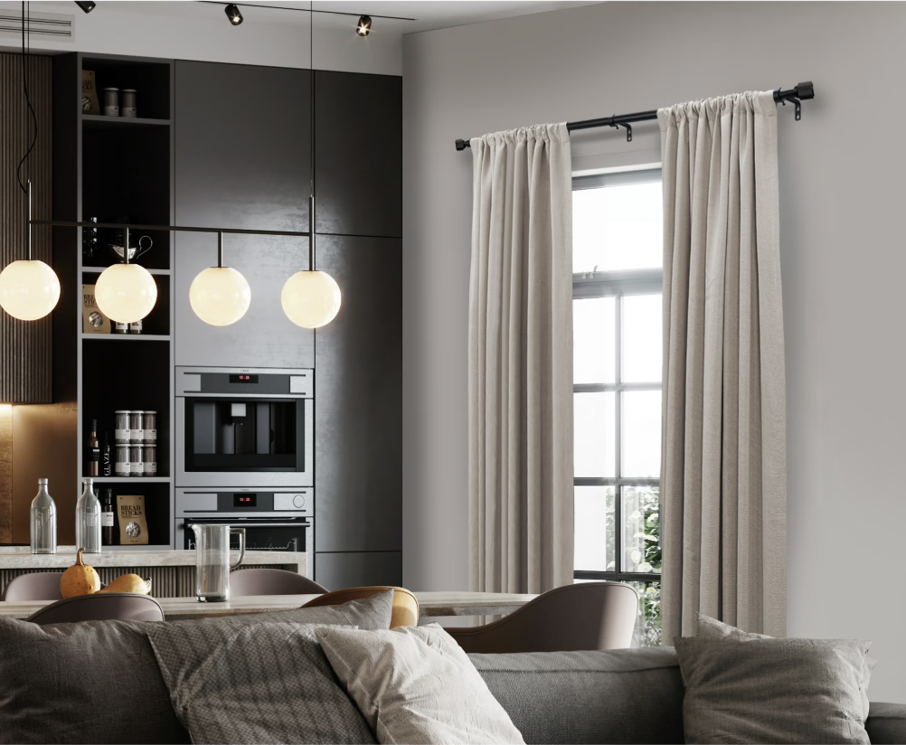 Modern living room featuring white curtains hung wide on an extended curtain rod.