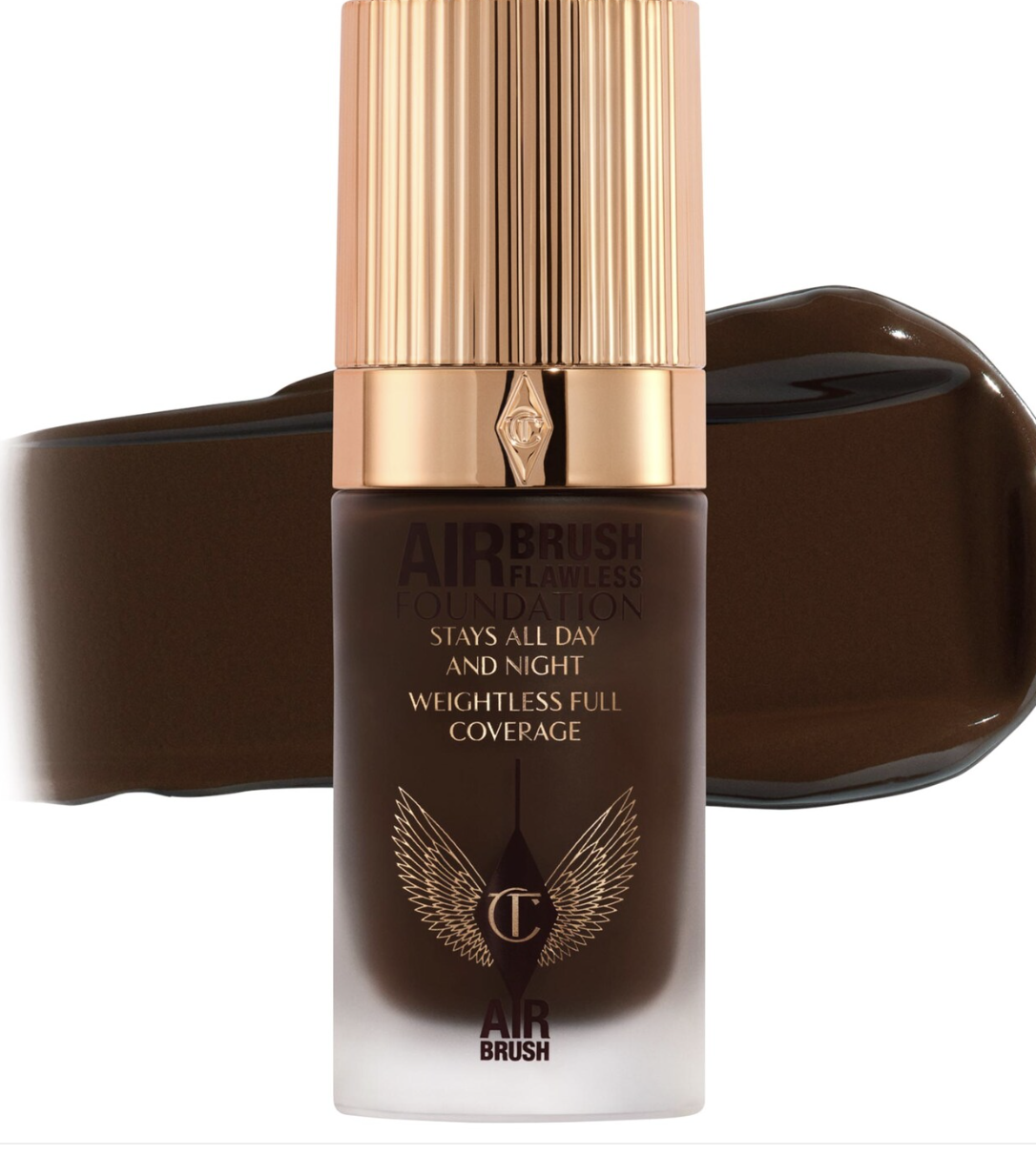 A bottle of Charlotte Tilbury Airbrush Flawless Foundation with a gold cap, shown against a clean white background.