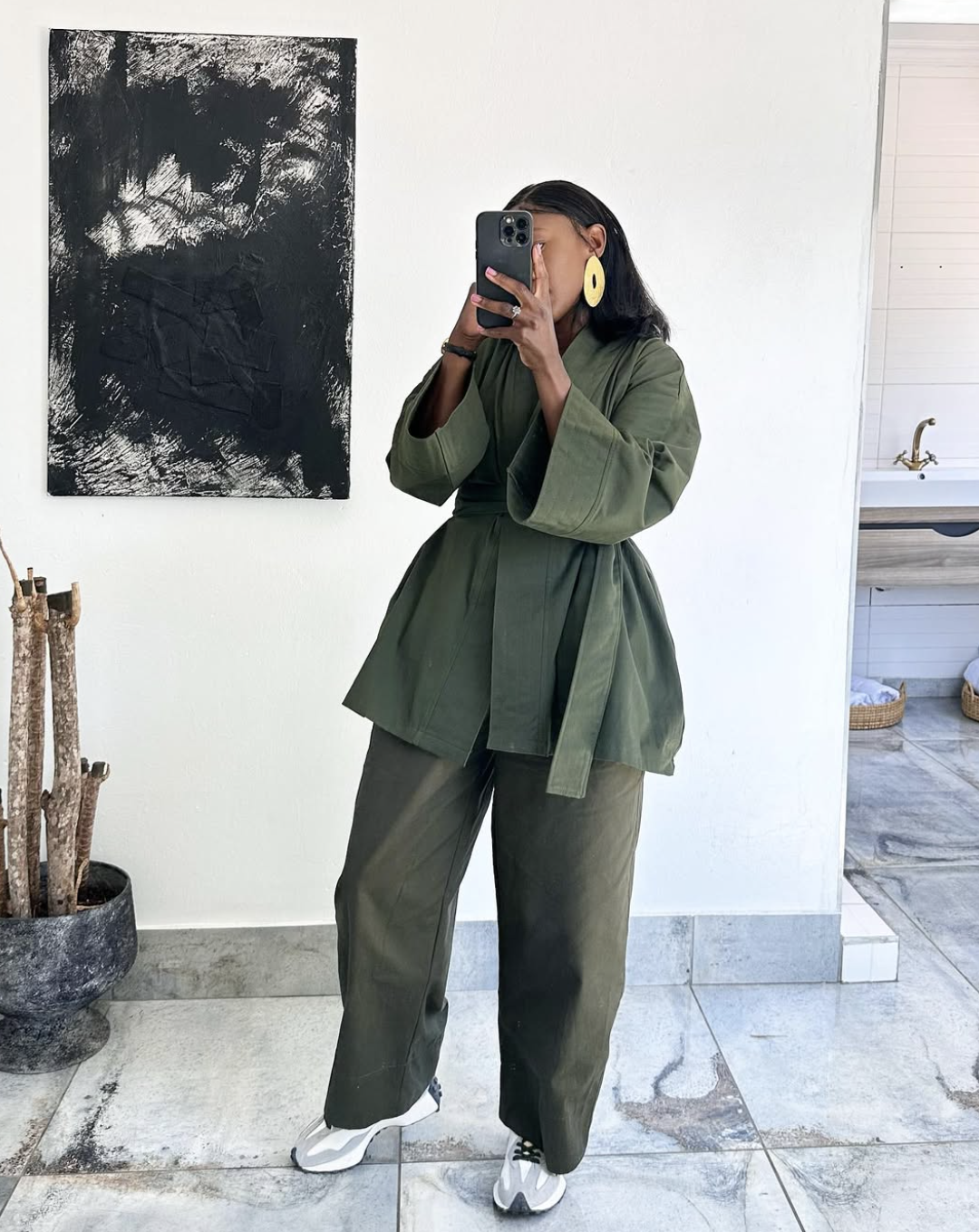 Tonal olive green fall outfit with layered jacket and knit