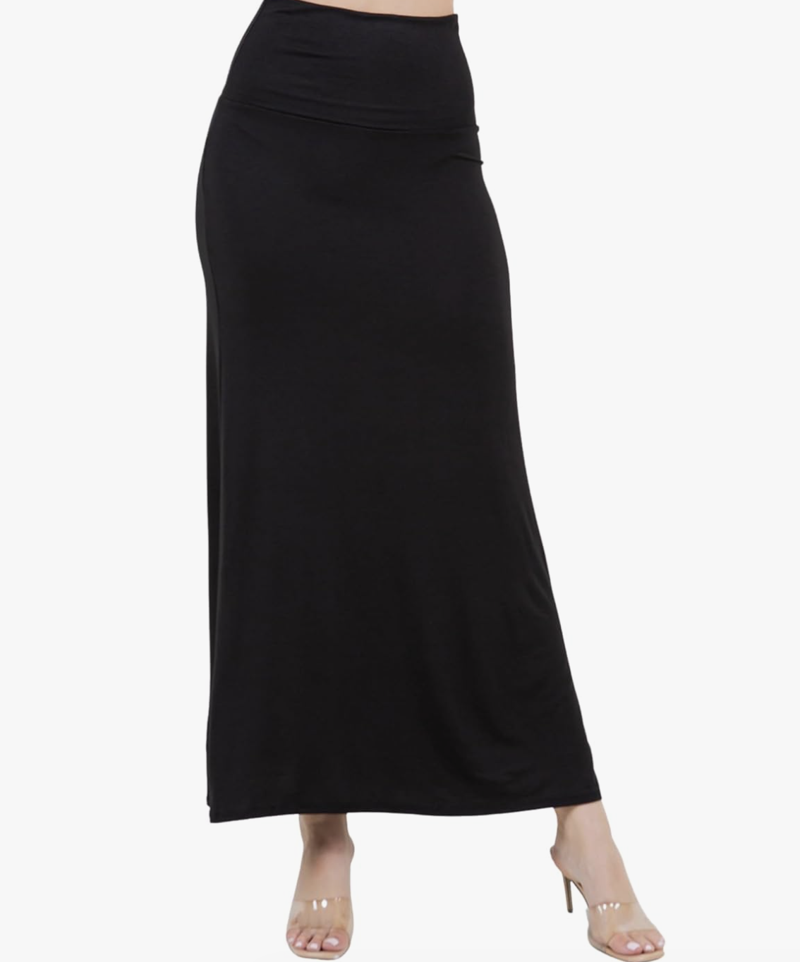 Woman wearing a high-waisted black jersey maxi skirt with a fold-over waistband and an ankle-length silhouette.