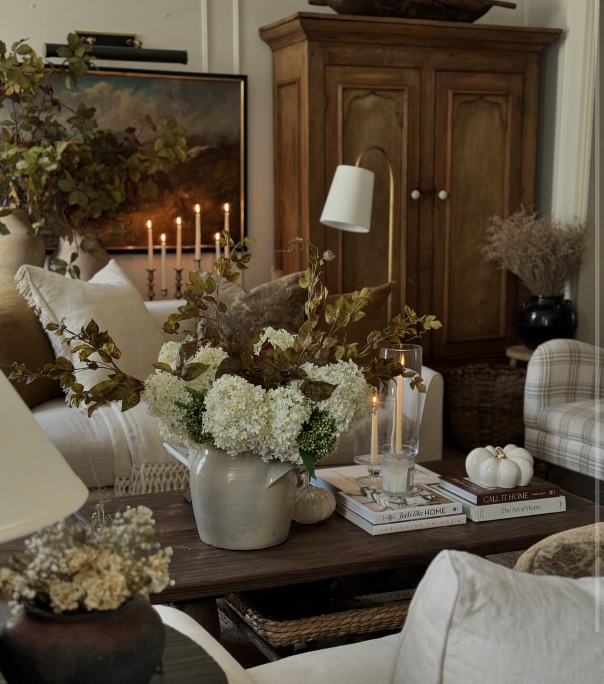Fall 2026 bedroom decor trend with warm, moody colors and layered textiles