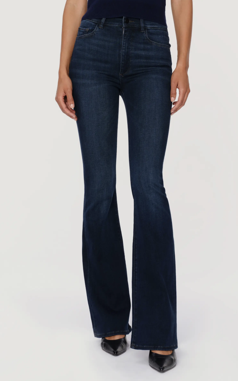 Close-up of a woman wearing dark wash DL1961 Bridget Instasculpt high-rise bootcut jeans with a slim fit through the leg.