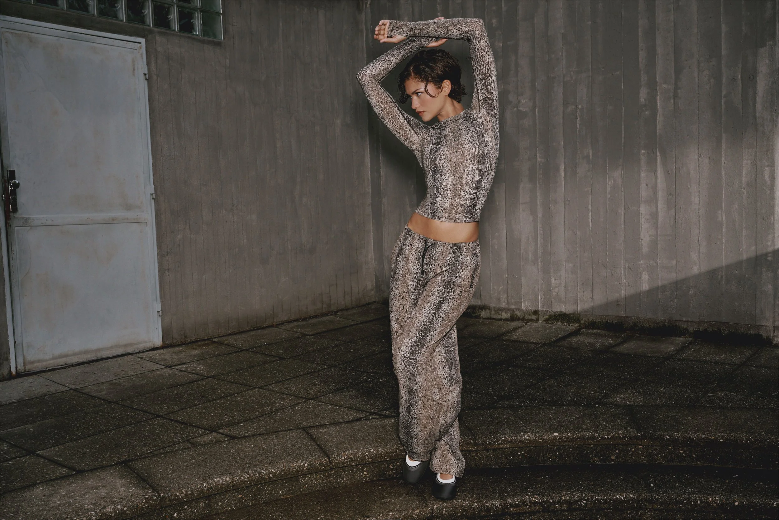 Zendaya wears the python-print Half-Zip Anorak from her 2026 On collection with Law Roach.