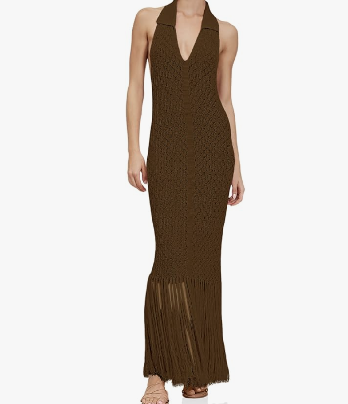 A woman wearing a chocolate brown halter-neck crochet midi dress with a semi-sheer knit pattern and long fringe trim along the hem
