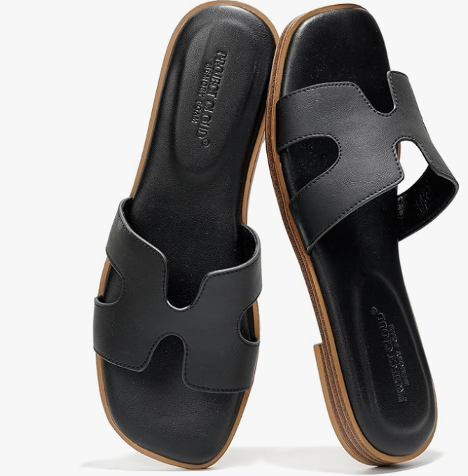A pair of brown leather slide sandals by Project Cloud with a contoured footbed, shown as a durable and stylish footwear option for what to wear on a cruise.