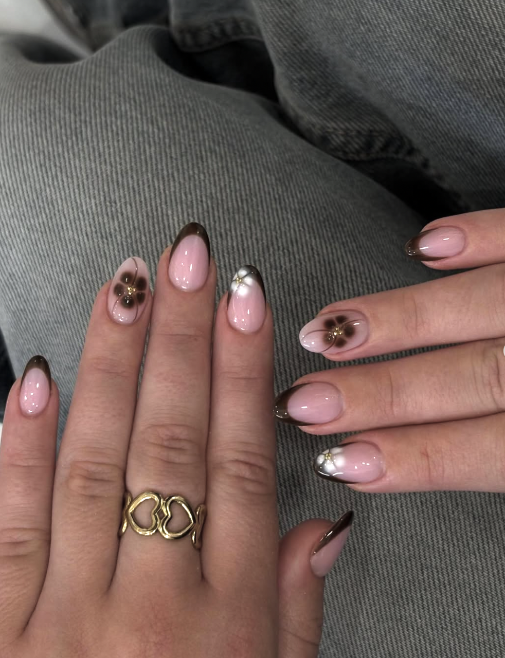 Close-up of cream-and-cocoa french on neatly manicured hands