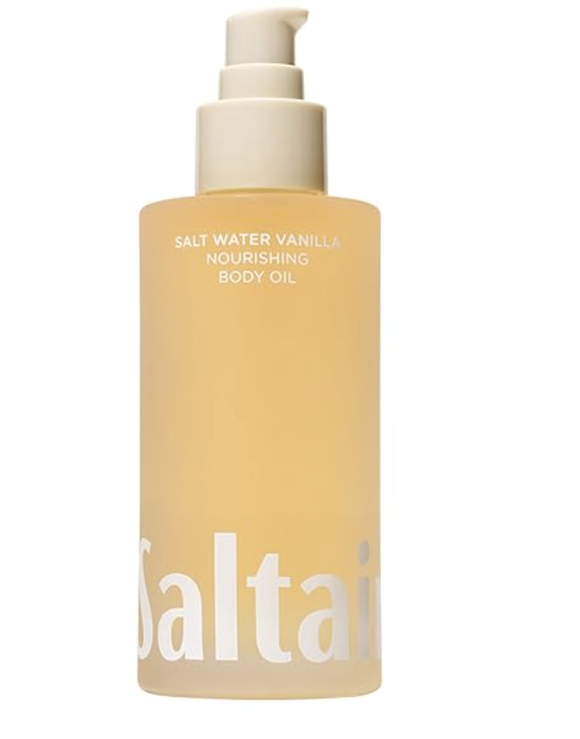 Small bottle of body oil on a folded tow