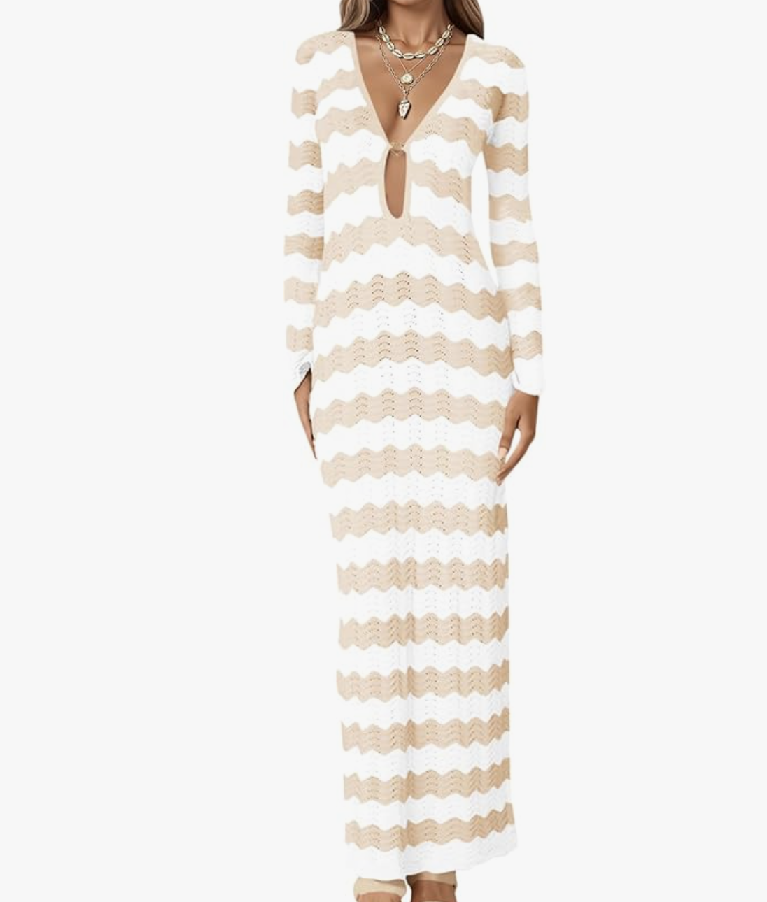 A woman wearing a lightweight, long-sleeve maxi dress featuring a V-neckline, front cut-out detail, and horizontal beige and white wavy stripes.