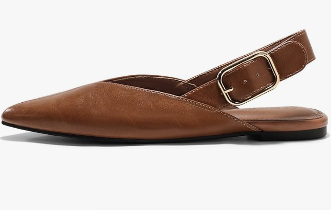 A pair of brown leather closed-pointed-toe slingback flats with a silver buckle strap, a comfortable and elegant footwear choice for a hybrid work capsule wardrobe.
