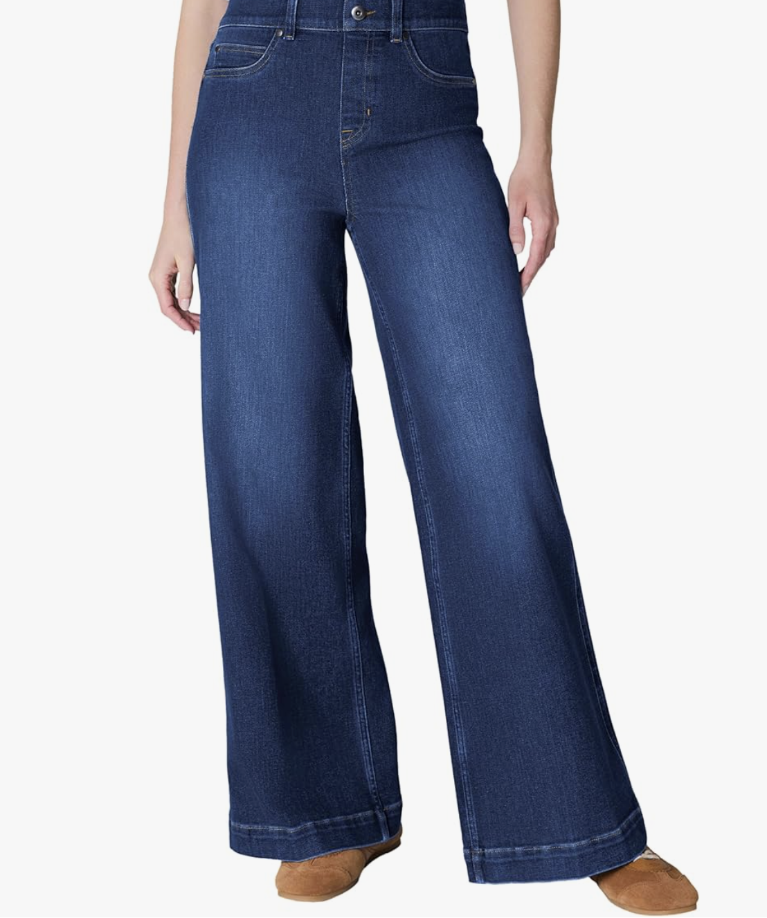 Rear view of Spanx barrel leg jeans showing the 360-degree shaping technology that lifts the seat and provides a structured, modern silhouette.