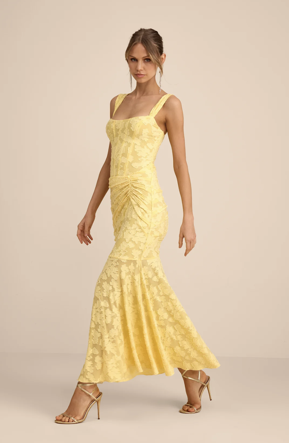 Model wearing the Lulus Celeste Yellow Floral Burnout Bustier Maxi Dress, a vintage-inspired piece perfect for the 2026 romantic heroine fashion trend.